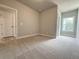 Cozy carpeted bedroom featuring a neutral paint and a closet at 5700 Urban Village Way # 1, Tucker, GA 30084