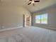 Sunny bedroom boasts vaulted ceiling, plush carpet, and a private bathroom at 5700 Urban Village Way # 1, Tucker, GA 30084