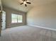 Inviting bedroom with a vaulted ceiling and large window at 5700 Urban Village Way # 1, Tucker, GA 30084