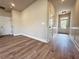 Spacious front hallway features wood-look floors, neutrally painted walls, and an exterior door at 5700 Urban Village Way # 1, Tucker, GA 30084