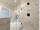 Modern shower featuring glass door and marble-patterned tiling at 5700 Urban Village Way # 1, Tucker, GA 30084
