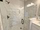Stylish shower featuring marble-like tile and modern fixtures at 5700 Urban Village Way # 1, Tucker, GA 30084