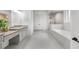 Modern bathroom features a walk-in shower, separate tub, and granite countertops at 885 Old Peachtree Ne Rd, Lawrenceville, GA 30043