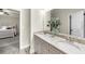 Bathroom features double sinks, decorative vanity, granite counters and view to bedroom at 885 Old Peachtree Ne Rd, Lawrenceville, GA 30043