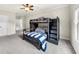 Bedroom with carpet, bunk beds with attached desk, and neutral paint at 885 Old Peachtree Ne Rd, Lawrenceville, GA 30043