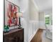 Elegant dining area featuring wainscoting, a sideboard, and a sun-drenched window at 885 Old Peachtree Ne Rd, Lawrenceville, GA 30043
