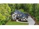 Stately two-story brick home with lush lawn, mature trees, and long driveway at 885 Old Peachtree Ne Rd, Lawrenceville, GA 30043