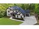 Handsome two-story brick home with attached garage, dark roof, and basketball hoop at 885 Old Peachtree Ne Rd, Lawrenceville, GA 30043