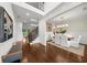 Inviting foyer with high ceilings, staircase with iron railing, and access to the dining room and living room at 885 Old Peachtree Ne Rd, Lawrenceville, GA 30043
