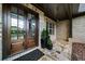 Elegant front porch with gorgeous double doors and stone paver flooring at 885 Old Peachtree Ne Rd, Lawrenceville, GA 30043