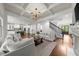 Open-concept living room with fireplace and kitchen view at 885 Old Peachtree Ne Rd, Lawrenceville, GA 30043