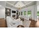 Open-concept living room with a fireplace, built-in shelving, and plenty of natural light at 885 Old Peachtree Ne Rd, Lawrenceville, GA 30043