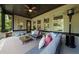 Inviting covered porch with comfortable seating, stylish decor, and outdoor heater for year-round enjoyment at 885 Old Peachtree Ne Rd, Lawrenceville, GA 30043