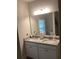 Bathroom with granite countertops, double sinks, and an oversized mirror at 100 Ruby Ln, Mcdonough, GA 30252