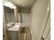 Well-lit bathroom with granite vanity, and shower-tub combo at 100 Ruby Ln, Mcdonough, GA 30252
