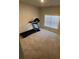 Cozy bedroom with neutral carpet and a window, perfect for a home gym or extra space at 100 Ruby Ln, Mcdonough, GA 30252