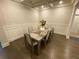 Elegant dining room featuring a stylish table and wainscoting at 100 Ruby Ln, Mcdonough, GA 30252