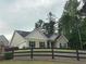 Well maintained, bright, single-story home featuring black shutters and a wooden fence at 100 Ruby Ln, Mcdonough, GA 30252