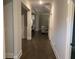 Inviting hallway showcasing hardwood floors and neutral paint leading to the living areas at 100 Ruby Ln, Mcdonough, GA 30252