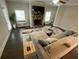 Comfortable living room with fireplace, large windows, and hardwood floors at 100 Ruby Ln, Mcdonough, GA 30252