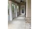 Covered patio with fan, decorative brick, and lots of light at 100 Ruby Ln, Mcdonough, GA 30252