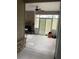Covered patio with stone fireplace, fan, and open windows at 100 Ruby Ln, Mcdonough, GA 30252