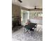 Sunroom featuring a stone fireplace and a sliding door to a backyard at 100 Ruby Ln, Mcdonough, GA 30252