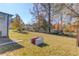 Backyard area with patio area, brick bar-b-que, and mature trees at 2103 Columbia Dr, Decatur, GA 30032