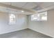 Finished basement area with wood-look flooring and natural light from windows at 2103 Columbia Dr, Decatur, GA 30032
