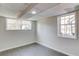 Finished basement with tiled floors, recessed lights and two windows for ample natural light at 2103 Columbia Dr, Decatur, GA 30032