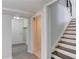 Basement stairway featuring wood and tiled floors with nearby access to the rooms at 2103 Columbia Dr, Decatur, GA 30032