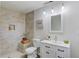 Bathroom features tiled walk-in shower, vanity, and modern lighting at 2103 Columbia Dr, Decatur, GA 30032