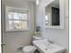 Bathroom with large window, modern fixtures, and stylish sink at 2103 Columbia Dr, Decatur, GA 30032