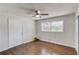 Cozy bedroom with wood floors, ceiling fan, window, and closet space at 2103 Columbia Dr, Decatur, GA 30032