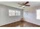 Bright bedroom with two windows, hardwood flooring, and neutral paint at 2103 Columbia Dr, Decatur, GA 30032