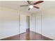 Bedroom features hardwood flooring, ceiling fan, closet, and doorway at 2103 Columbia Dr, Decatur, GA 30032