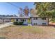 Charming single-Gathering home with a well-maintained front yard and bright yellow front door at 2103 Columbia Dr, Decatur, GA 30032