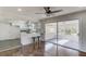 Modern kitchen with white cabinets, stainless appliances, and a connected sunroom at 2103 Columbia Dr, Decatur, GA 30032