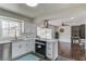 A modern kitchen with quartz countertops and an open concept with sight lines to the living room and staircase at 2103 Columbia Dr, Decatur, GA 30032