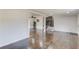 Spacious living room with hardwood floors, modern lighting, and open access to other rooms at 2103 Columbia Dr, Decatur, GA 30032
