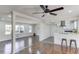This living room features hardwood floors and an open concept leading to the kitchen at 2103 Columbia Dr, Decatur, GA 30032