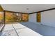 Covered patio with black iron railings and view of the landscaped backyard at 2103 Columbia Dr, Decatur, GA 30032