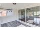 Bright sunroom features gray wood-look flooring, white walls, and sliding glass doors to the living space at 2103 Columbia Dr, Decatur, GA 30032