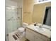 Bathroom featuring a walk-in shower with sliding glass doors and a single vanity at 2840 General Lee Way, Buford, GA 30519