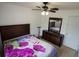 Cozy bedroom with a ceiling fan, a large dresser, and neutral carpet at 2840 General Lee Way, Buford, GA 30519
