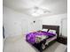 Spacious bedroom features soft carpet, a ceiling fan, and neutral paint at 2840 General Lee Way, Buford, GA 30519