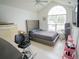 Bedroom with a ceiling fan, tiled floors, and a modern upholstered bed at 2840 General Lee Way, Buford, GA 30519