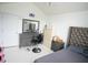 Bedroom with a ceiling fan, tiled floors, and a modern upholstered bed at 2840 General Lee Way, Buford, GA 30519