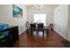 Formal dining room featuring classic wainscoting and hardwood floors at 2840 General Lee Way, Buford, GA 30519