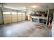This garage features a large door, open ceilings, and concrete floors at 2840 General Lee Way, Buford, GA 30519